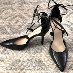 Black pointed toe Nine West heels with wrap detail